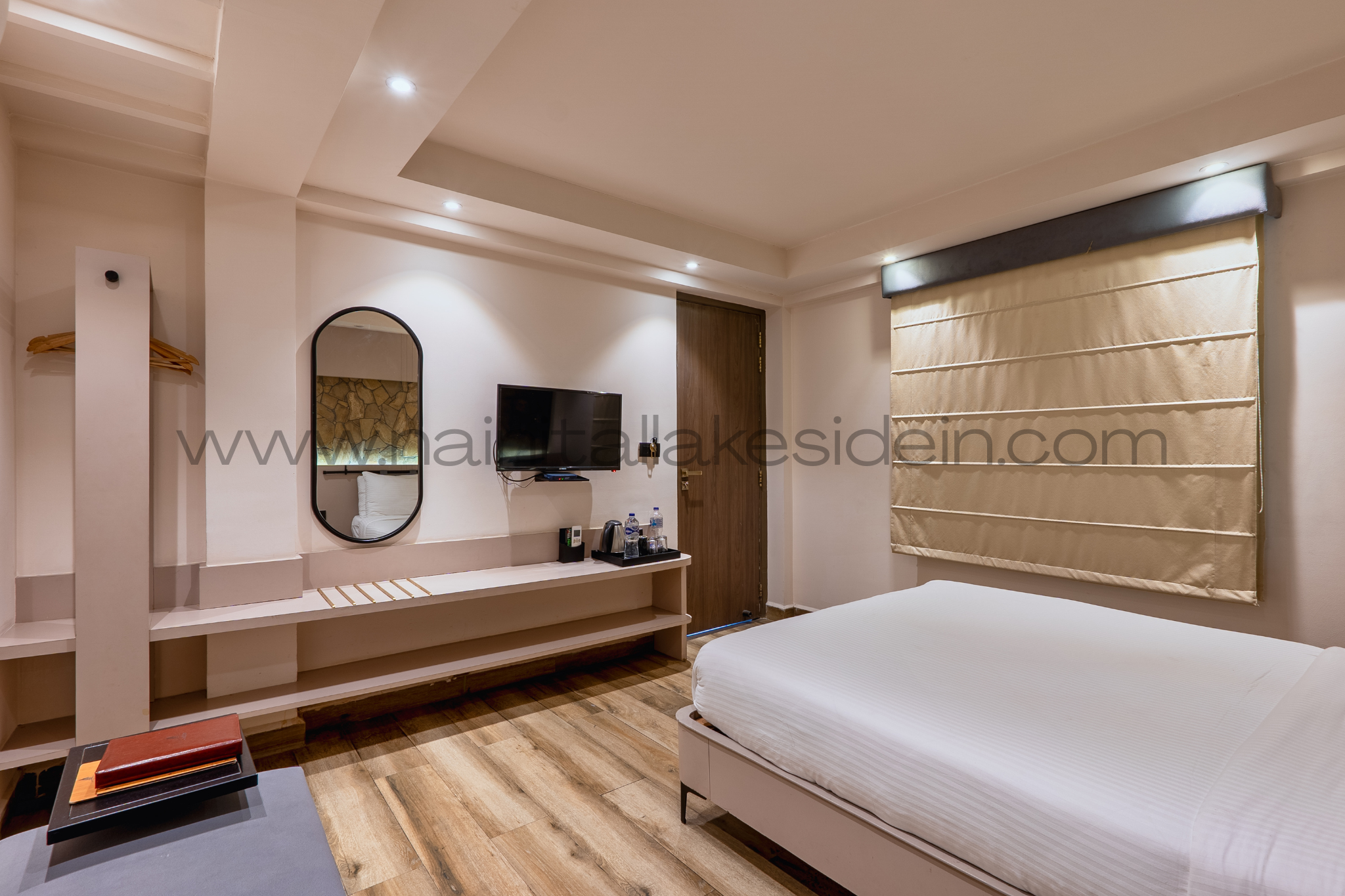 Comfortable bed in Oak Room, LakeSide Inn